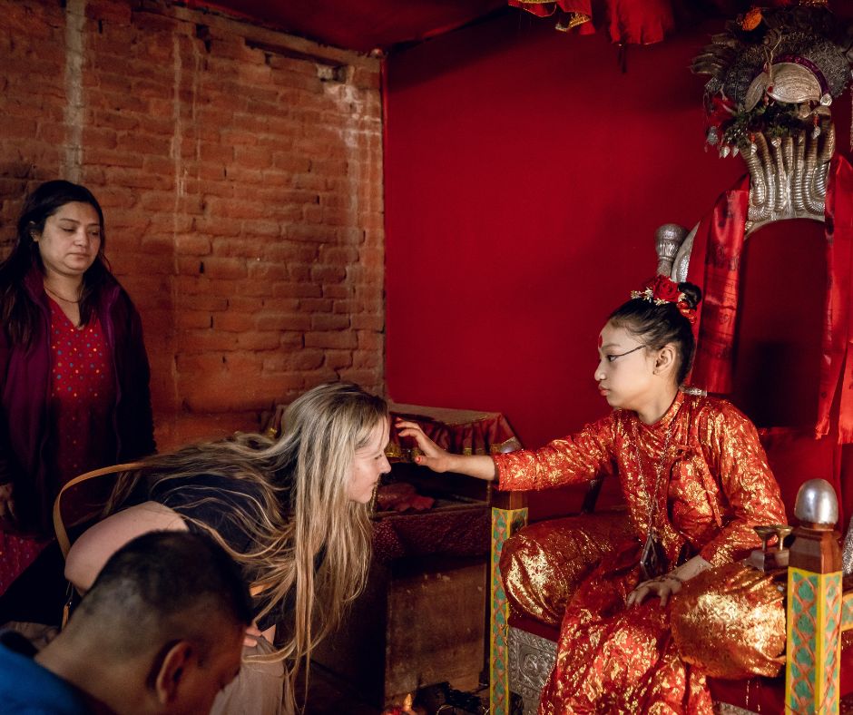 Receiving a blessing from the Kumari